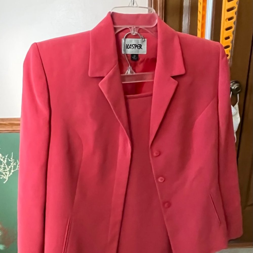 Ladies Pink Kaspar Suit with slight Ruffle at the bottom of skirt